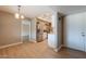 Spacious dining room with wood floors adjacent to kitchen, offering ample space and style at 4622 E Flower Ave, Mesa, AZ 85206