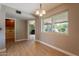 Dining room filled with natural light from large windows and view to exterior at 4622 E Flower Ave, Mesa, AZ 85206