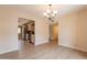 Light-filled dining room with open access to kitchen with stainless steel appliances and ample cabinet space at 4622 E Flower Ave, Mesa, AZ 85206
