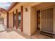Inviting front entrance with red-brick accents, a 'welcome' mat, and a charming, secure screen door at 4622 E Flower Ave, Mesa, AZ 85206
