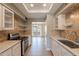 Bright kitchen featuring modern appliances, granite countertops, and stylish backsplash at 4622 E Flower Ave, Mesa, AZ 85206