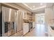 Kitchen view showcasing stainless steel refrigerator, sleek countertops, and modern appliances at 4622 E Flower Ave, Mesa, AZ 85206