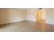 Bright, open living room with modern wood flooring and a welcoming entryway for guests at 4622 E Flower Ave, Mesa, AZ 85206