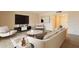 Comfortable living room furnished with modern seating, sleek entertainment center, and contemporary accents at 4622 E Flower Ave, Mesa, AZ 85206