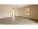Generous living area featuring wood floors and access to other rooms, including the kitchen at 4622 E Flower Ave, Mesa, AZ 85206