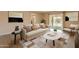 Stylishly furnished living room with modern decor, cozy seating, and access to outdoor patio at 4622 E Flower Ave, Mesa, AZ 85206