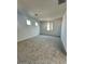 Spacious carpeted bedroom with multiple windows at 25321 W Bowker St, Buckeye, AZ 85326