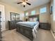 Comfortable bedroom with a gray dresser and carpet flooring at 3700 E Carob Dr, Gilbert, AZ 85298