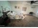 Well-lit bedroom features comfortable carpet and a ceiling fan for added comfort at 2661 N Higley Rd, Mesa, AZ 85215