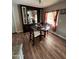 Cozy dining area with a glass-top table and a view into the kitchen at 2661 N Higley Rd, Mesa, AZ 85215