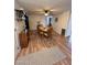 Charming dining area with wood-look flooring and a view into the living room at 2661 N Higley Rd, Mesa, AZ 85215