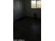 View of the front door leading to a room with wood-look floors and a window at 2661 N Higley Rd, Mesa, AZ 85215