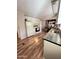 Efficient kitchen featuring wood-look flooring and a dining area at 2661 N Higley Rd, Mesa, AZ 85215