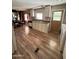Efficient kitchen and laundry area with wood-look flooring and ample cabinetry at 2661 N Higley Rd, Mesa, AZ 85215