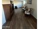 Inviting living room with nice wood flooring and two sitting chairs at 2661 N Higley Rd, Mesa, AZ 85215