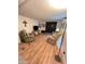 Inviting living room with comfortable seating and warm, wood-look flooring at 2661 N Higley Rd, Mesa, AZ 85215