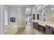 Large Primary bathroom with double vanity, soaking tub, and glass block shower at 4276 E Meadowview Dr, Gilbert, AZ 85298