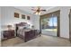 Bright bedroom featuring a large window, wooden furniture, and plush bedding at 4276 E Meadowview Dr, Gilbert, AZ 85298