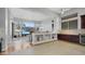Open kitchen with dark wood cabinets and breakfast bar at 4276 E Meadowview Dr, Gilbert, AZ 85298