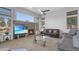 Living room with stone fireplace and large windows at 4276 E Meadowview Dr, Gilbert, AZ 85298