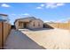 Wide-angle shot of the backyard with cinder block fence for privacy at 20254 W Roma Ave, Litchfield Park, AZ 85340