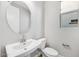 Powder room with a pedestal sink and brushed nickel fixtures at 20254 W Roma Ave, Litchfield Park, AZ 85340