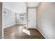 Bright entryway featuring wood-look tile floors, neutral walls, and lots of natural light at 20254 W Roma Ave, Litchfield Park, AZ 85340