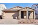 Charming single-story home with stone accents, a tile roof, and a two-car garage at 20254 W Roma Ave, Litchfield Park, AZ 85340