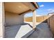 An inviting covered patio extends to a private backyard surrounded by a sturdy block fence at 20254 W Roma Ave, Litchfield Park, AZ 85340