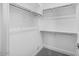 Spacious walk-in closet with multiple shelves and clothing rods for optimal organization at 20254 W Roma Ave, Litchfield Park, AZ 85340