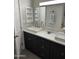 Bathroom featuring dual vanities with modern sinks and cabinets, plus a medicine cabinet at 2142 E Donner Dr, Tempe, AZ 85282