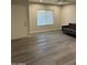 A view of the Living Room with a dark gray sofa and gray-tone flooring at 2142 E Donner Dr, Tempe, AZ 85282