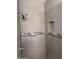 Modern shower with neutral tile, a built-in niche, and sleek hardware at 2142 E Donner Dr, Tempe, AZ 85282