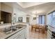 Kitchen with a view of the dining area and living room at 10401 N Saguaro Blvd # 132, Fountain Hills, AZ 85268