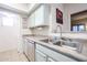 Kitchen with stainless steel sink and dishwasher, and teal cabinets at 10401 N Saguaro Blvd # 132, Fountain Hills, AZ 85268