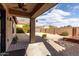 Covered patio overlooking a landscaped backyard with fire pit at 1245 N Compton Cir, Mesa, AZ 85207