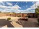 Landscaped backyard with fire pit and sitting area at 1245 N Compton Cir, Mesa, AZ 85207