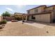 Landscaped backyard featuring a fire pit and patio at 1245 N Compton Cir, Mesa, AZ 85207
