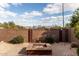 Landscaped backyard with fire pit and mountain views at 1245 N Compton Cir, Mesa, AZ 85207