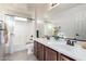 Bathroom with double sinks, a shower/tub combo and a linen closet at 1245 N Compton Cir, Mesa, AZ 85207