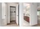 Bathroom with double vanity and linen closet at 1245 N Compton Cir, Mesa, AZ 85207