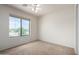 Bedroom with ceiling fan and large window at 1245 N Compton Cir, Mesa, AZ 85207
