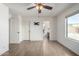 Bedroom with wood-look floors, ceiling fan, and ensuite bathroom at 1245 N Compton Cir, Mesa, AZ 85207
