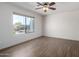 Bright bedroom with wood-look floors and ceiling fan at 1245 N Compton Cir, Mesa, AZ 85207