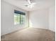 Bright bedroom with carpeted floor and ceiling fan at 1245 N Compton Cir, Mesa, AZ 85207