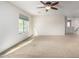 Spacious bedroom with ceiling fan and carpet at 1245 N Compton Cir, Mesa, AZ 85207