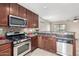 Kitchen features granite countertops and stainless steel appliances at 1245 N Compton Cir, Mesa, AZ 85207