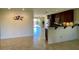 Kitchen area features dark wood cabinets, tile flooring, and a breakfast bar at 1245 N Compton Cir, Mesa, AZ 85207