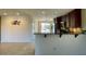 Cozy kitchen boasts dark wood cabinets, modern appliances, and bar seating area at 1245 N Compton Cir, Mesa, AZ 85207