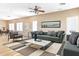 Bright living room with modern furnishings, ceiling fan, and hardwood floors at 4536 W Rolling Rock Dr, Phoenix, AZ 85086